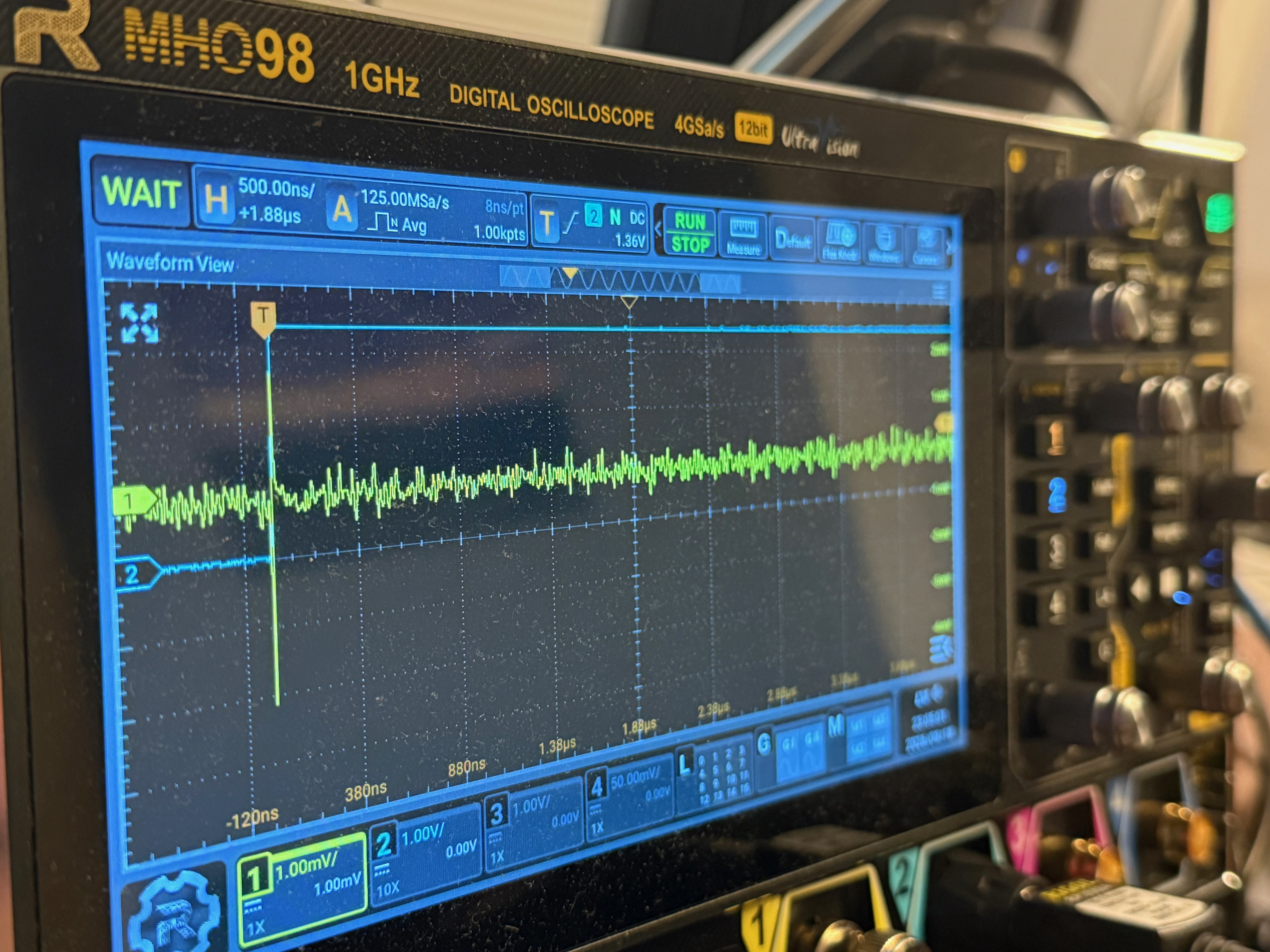 Rigol MHO98 displaying the EM measurement on channel 1 and the GPIO trigger on channel 2.